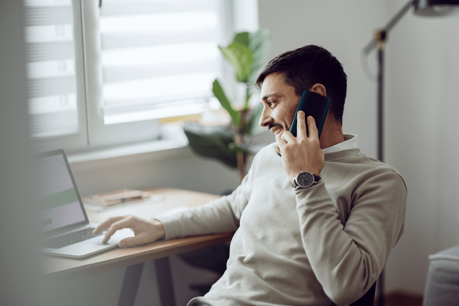 Image of a man uses a laptop for online trading to represent DeltaXE - Trade Logistics and Scheduling